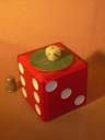 musical dice, on the green part , there was a statue or something how turns when I switch on